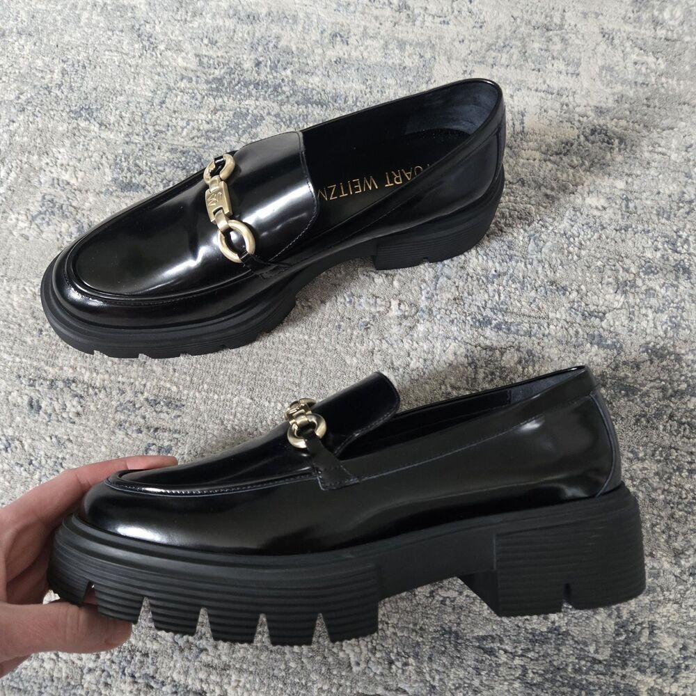 Brand new Stuart Weitzman Black Patent Leather Lug Sole Loafers with Gold logo….